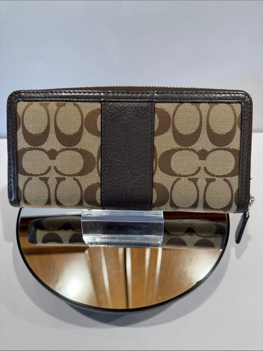 Coach Brown/Tan Signature Zip Wallet with Logo Plaque tags inside.